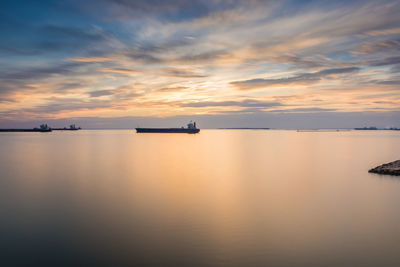 Scenic view of sea against sky during sunset