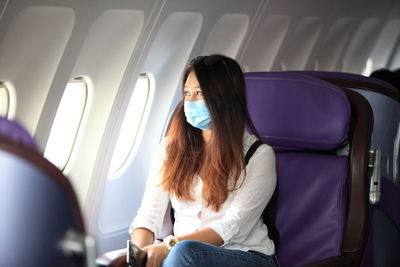 Woman sitting in airplane