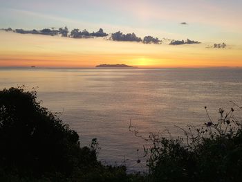 Scenic view of sea against sky during sunset