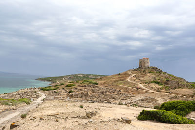 Ruins of castle against cloudy sky