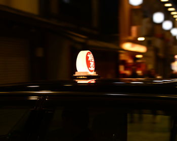 Close-up of illuminated information sign at night