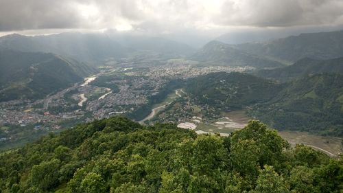 Aerial view of valley and mountains against sky