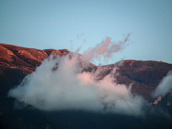 Close-up of man in water against sky