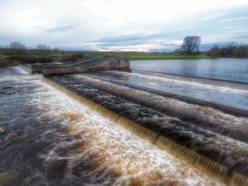 Scenic view of dam against sky