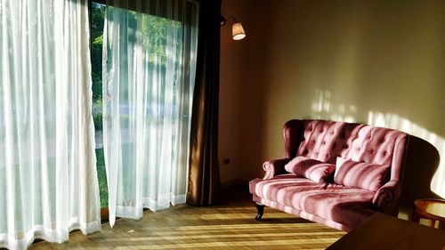 Empty sofa in hall at home