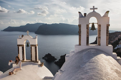 Scenic view of sea and buildings against sky