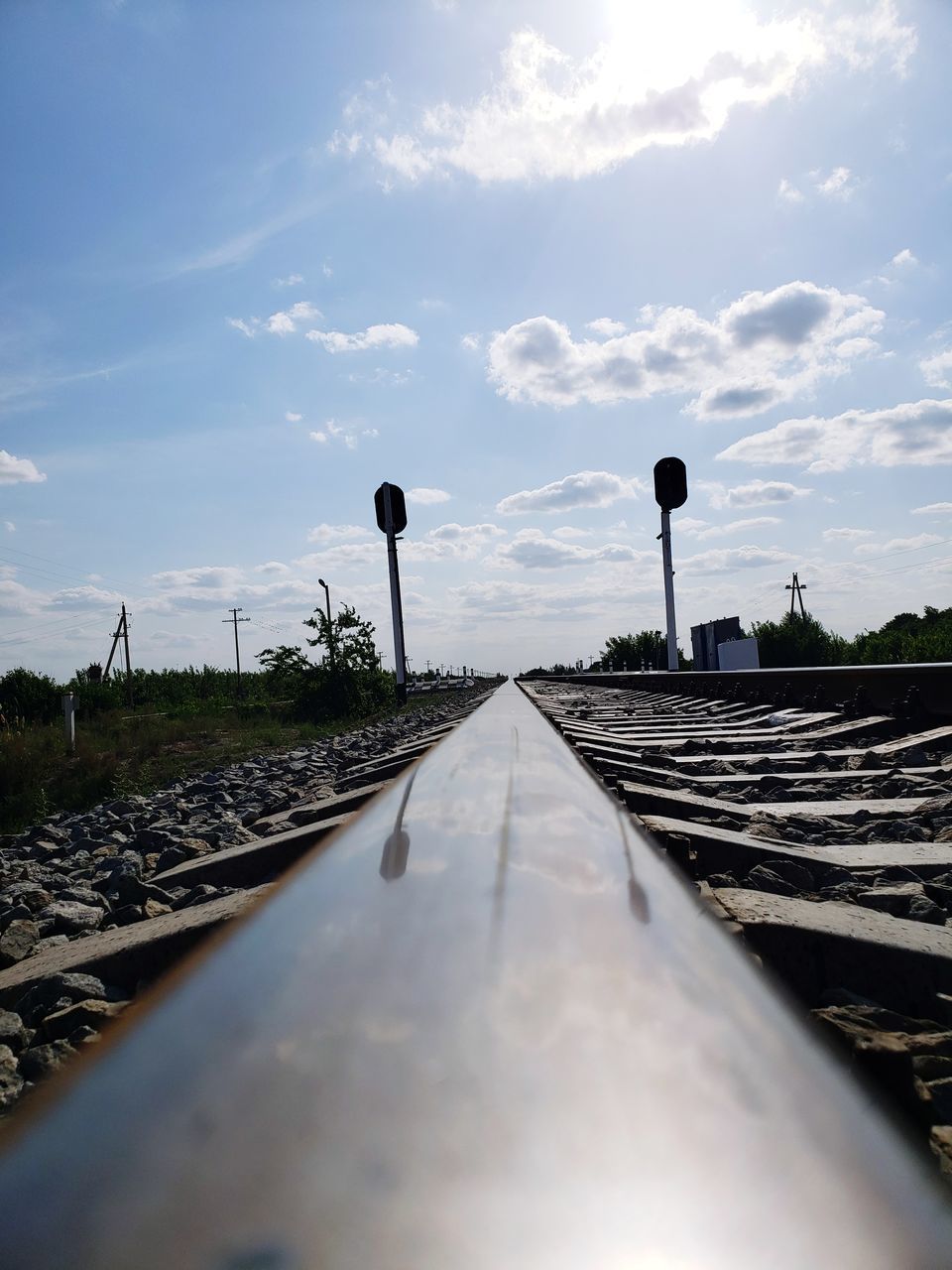 RAILROAD TRACKS AGAINST SKY