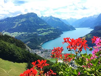Scenic view of lake and mountains against sky