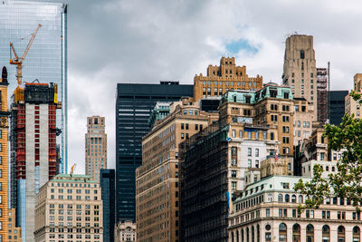 Buildings in city against sky