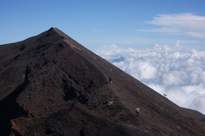 Scenic view of volcanic mountain against sky