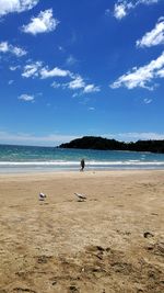 Man on beach against sky