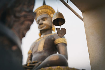 Low angle view of buddha statue