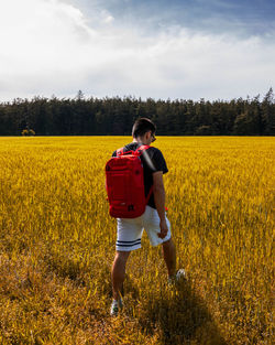 Full length of man walking on field