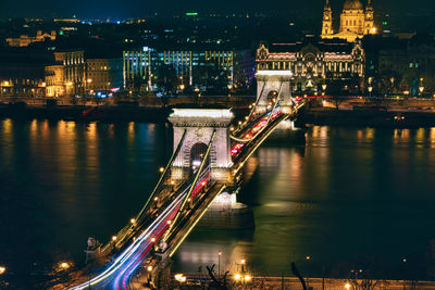 Aerial view of bridge over river at night