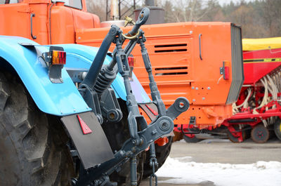 Construction vehicles in parking lot during winter