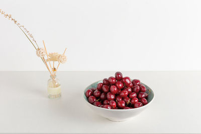 High angle view of strawberries in bowl on table