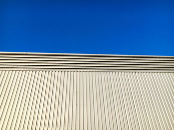 Low angle view of building against blue sky