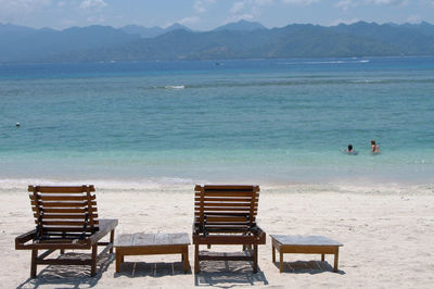 Deck chairs overlooking calm blue sea