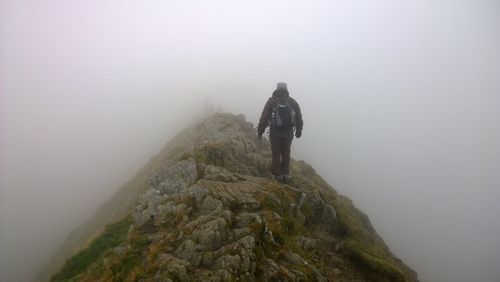 Man on rock in mountains