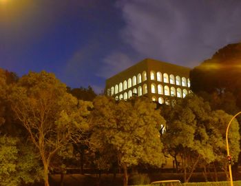 Low angle view of building against cloudy sky