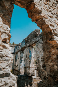 Turkey fethiye kayakoy - low angle view of old ruin building against sky