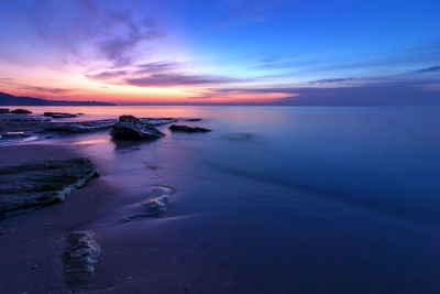 Scenic view of sea against sky at sunset