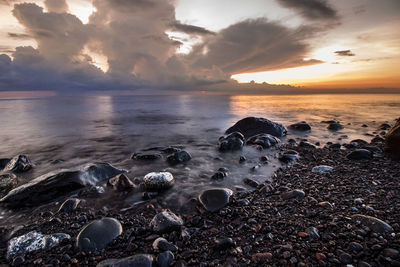 Scenic view of sea against cloudy sky