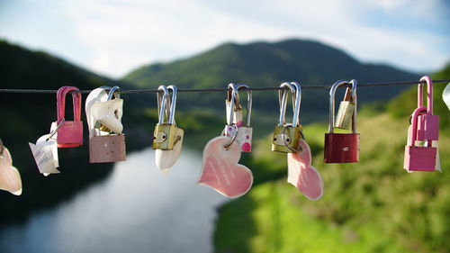 Close-up of padlocks hanging on rope