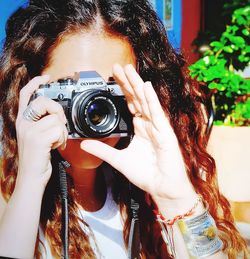 Portrait of woman photographing