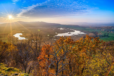Scenic view of landscape against sky during sunset