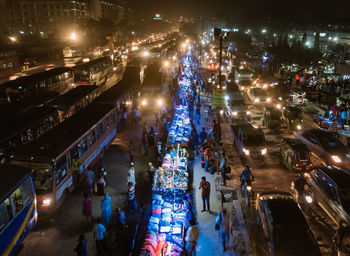 High angle view of crowd on road at night