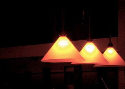 Illuminated lamp post at night