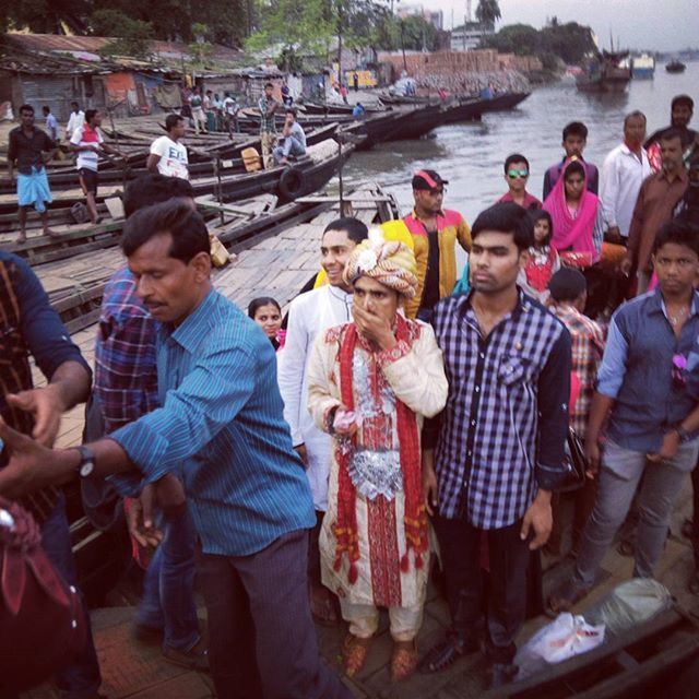 large group of people, people, lifestyles, leisure activity, mixed age range, crowd, togetherness, food and drink, medium group of people, high angle view, sitting, street, market, outdoors, casual clothing, day, market stall, occupation