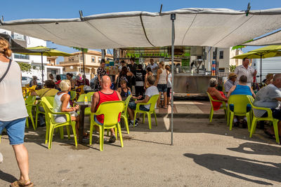 Group of people sitting on chair at table