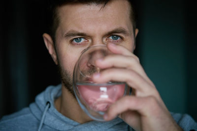 Close-up of man drinking water