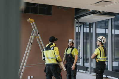 People talking at construction site