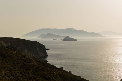 Scenic morning view of santorini from folegandros island  against clear sky