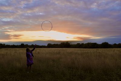 Portrait of a girl against a sunset background