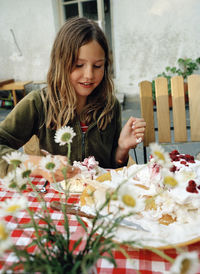 Smiling girl eating cake