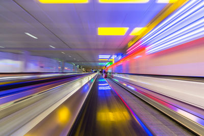 Blurred motion of moving walkway at airport