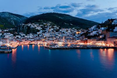 Townscape by sea against sky in city