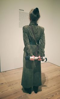 Full length of woman standing by railing