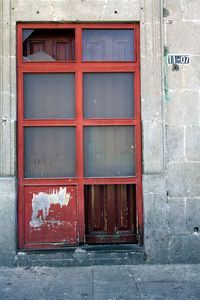 Closed red door of window