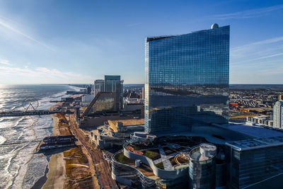 Modern buildings in city against sky