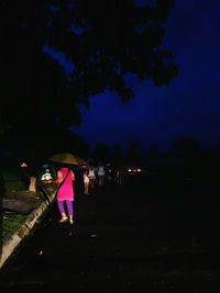 Multi colored umbrella at night