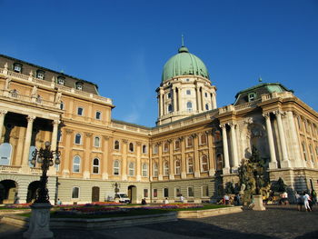 Facade of historic building against clear sky