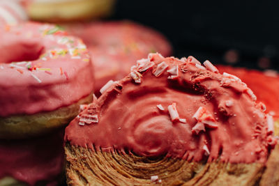 Delicious sweet bun with pink raspberry topping