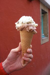 Hand holding ice cream cone