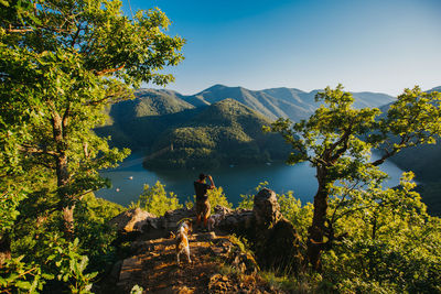 Scenic view of tree mountains against sky