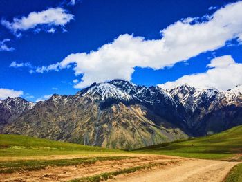 Scenic view of snowcapped mountains against sky